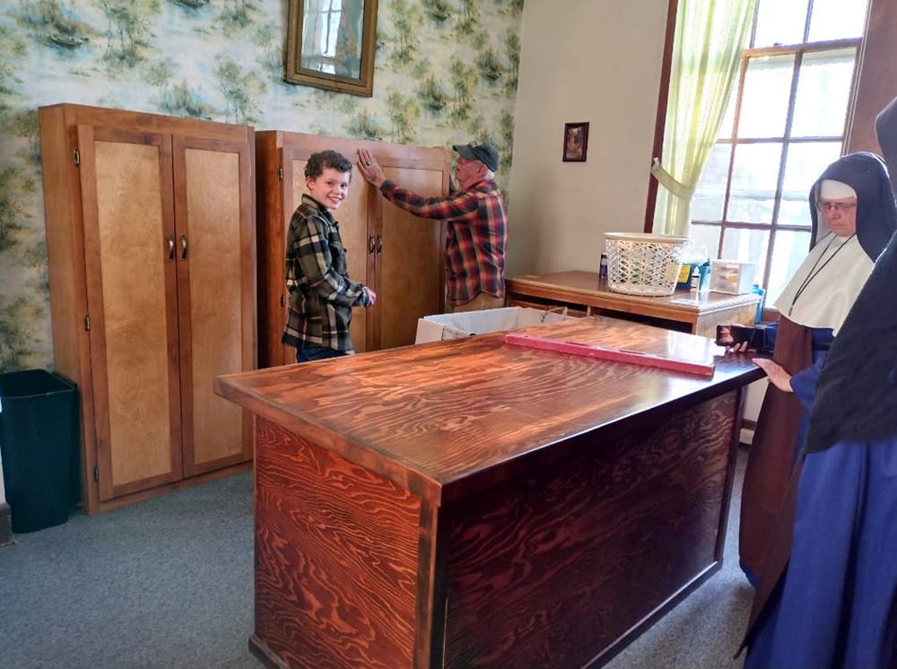 Mr. Murry’s apprentice, William, helped to build these cabinets. Since they were for the Sisters’ cloister, he gets a sneak peek of the convent during installation.