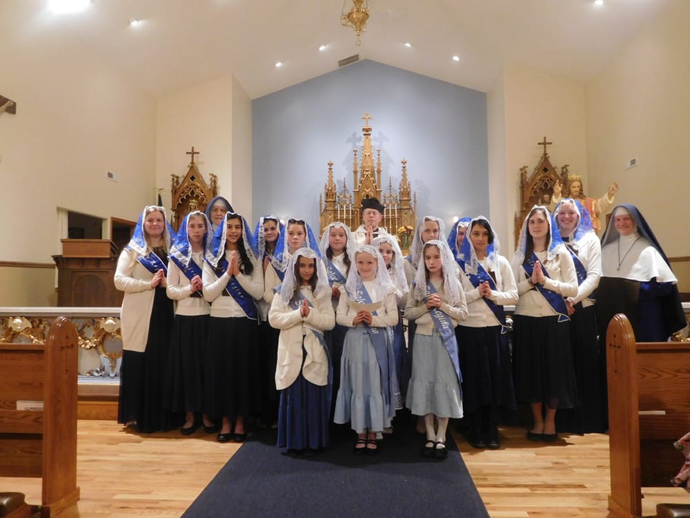 Fr. Benedict Hughes, Sr. Mary Imelda and Sr. Mary Genevieve pose with Sodalists at Mary Immaculate Queen (Rathdrum, Idaho) after their reception ceremony.