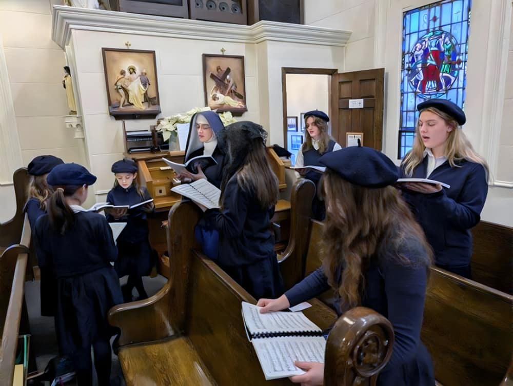 Sisters and students sing during Mass at Our Lady of the Rosary Church in Middleville, Michigan.
