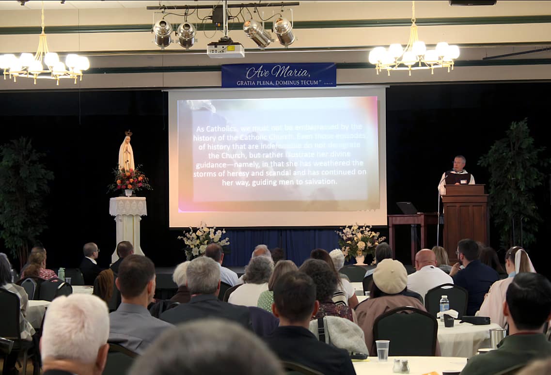 Fr. Benedict uses slides to illustrate his points.