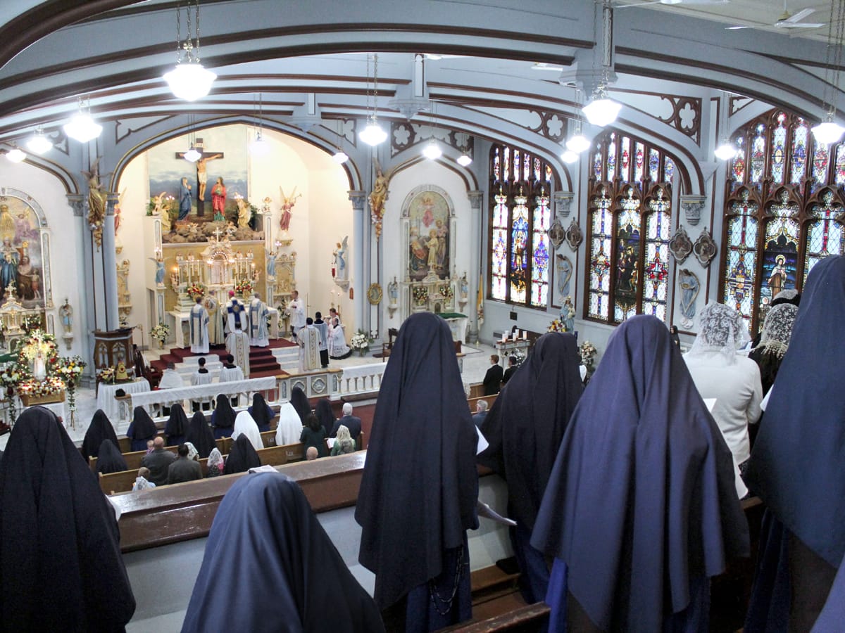 Sisters and students sing for the pontifical high Mass