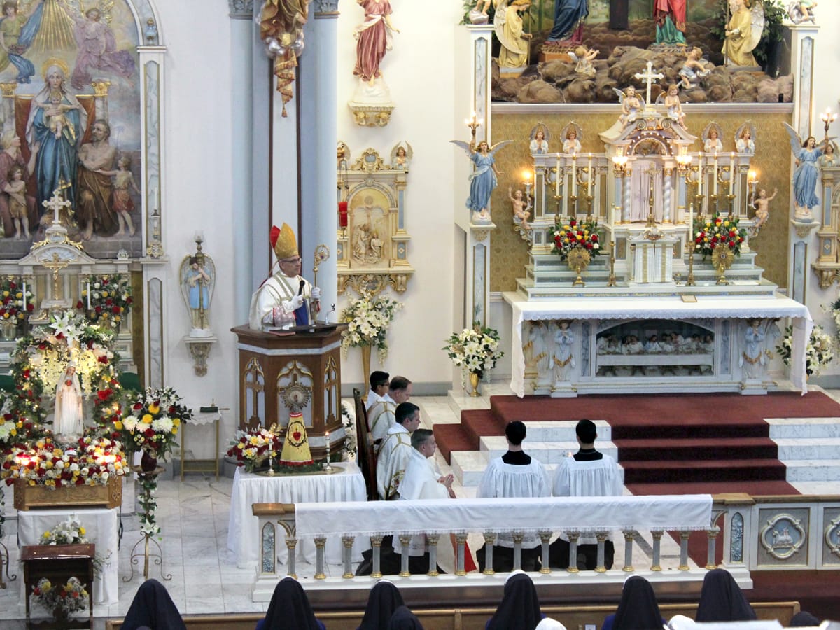 His Excellency gives a sermon during the pontifical high Mass