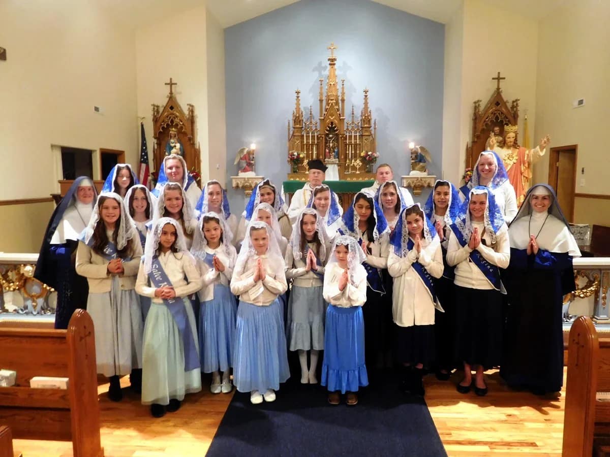 Many earnest lovers of Mary pose for a photo after the Sodality advancement at Mary Immaculate Queen Church in Rathdrum, Idaho.