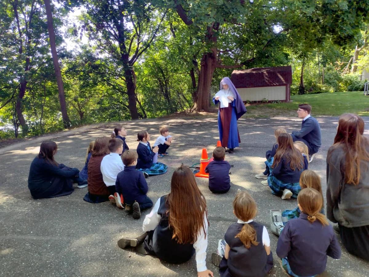It almost looks like Mount St. Michael, but no! It’s Sr. Mary Angela teaching a new game to students at Holy Rosary School in Middleville.