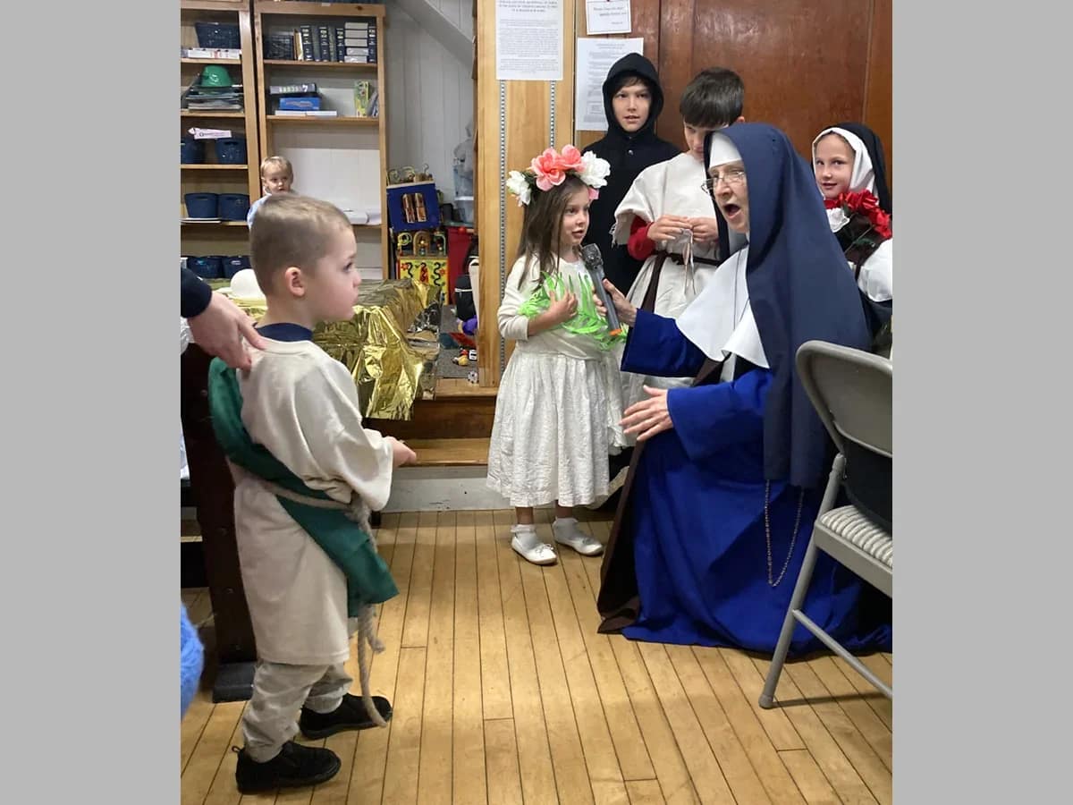 Sr. Mary Bernadette interacts with the tiny saints at Our Lady of Mount Carmel Parish in Salem, New Hampshire.
