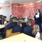 The students of St. Philomena’s in Middleville, Michigan, enjoy a game led by Sr. Mary Teresita during their celebration of the feast of St. John Bosco. Sr. Mary Teresita leads her students in a game on St. John Bosco Day during Catholic Schools Week.