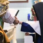 After having made profession of perpetual vows, Sr. Philomena Marie receives a gold band, a symbol of her eternal union with Christ Crucified.