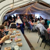 As one of the founding Sisters of Holy Guardian Angels Academy in Olathe, Rev. Mother was invited to join in their Silver Jubilee celebration. Reverend Mother visits with parishioners at the 25th anniversary celebration of Holy Guardian Angels Academy.