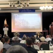 Fr. Benedict uses slides to illustrate his points.