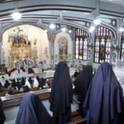 Sisters and students sing for the pontifical high Mass