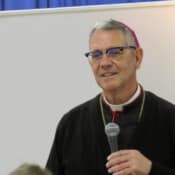 Bishop Pivarunas listens to a question from the audience.
