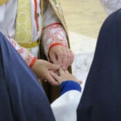 Sister receives her ring of profession from the Bishop.