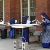 The Sisters take a few hours to help seminarian Seminarian Thomas Netzel with his annual summer job of repainting the hundreds of windows at Mount St. Michael.