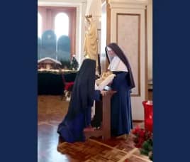 From youngest to oldest each Sister approaches to kiss the feet of the Infant Jesus while special devotions are read.