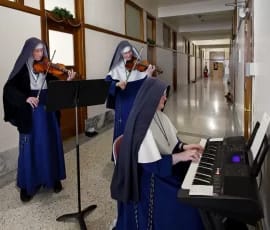 Our budding violinists share their talent with some Christmas tunes for our enjoyment. (The acoustics in the hall are wonderful!)