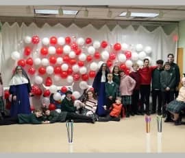 Sr. Bernardine Marie and Sr. Maria Magdalena pose with their students during “Heart-chery” Games at St. Joseph's Academy in Wayne, Michigan, in honor of St. Valentine.