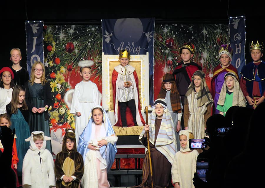 The "Infant of Prague" makes his appearance at the Christmas grade school program at St. Michael's Academy in Spokane, Washington.