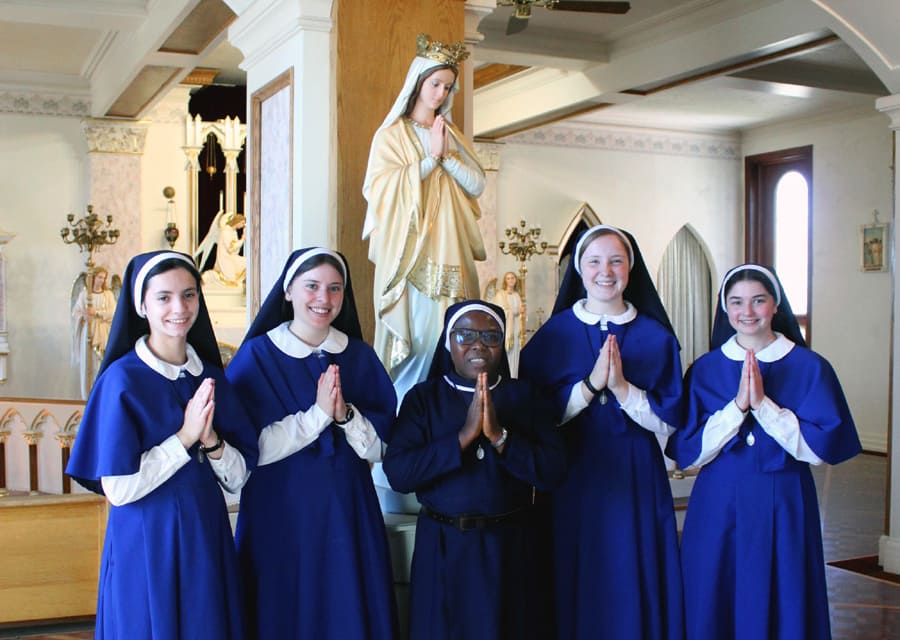 Sister Immaculata poses with our four other postulants after the reception ceremony.
