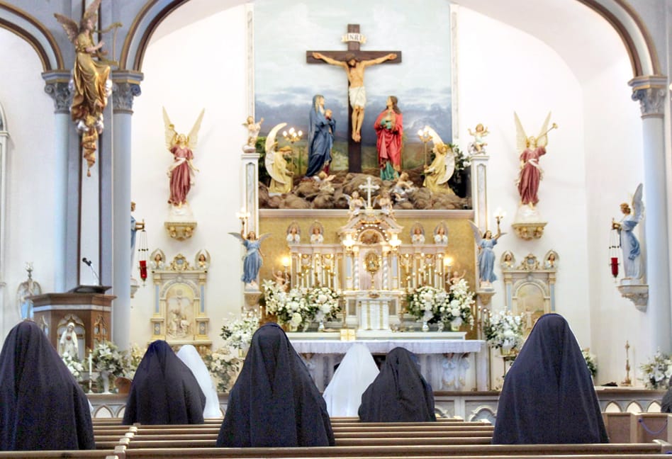 Sisters praying before Our Lord exposed on the altar during the Forty Hours at Mount St. Michael.