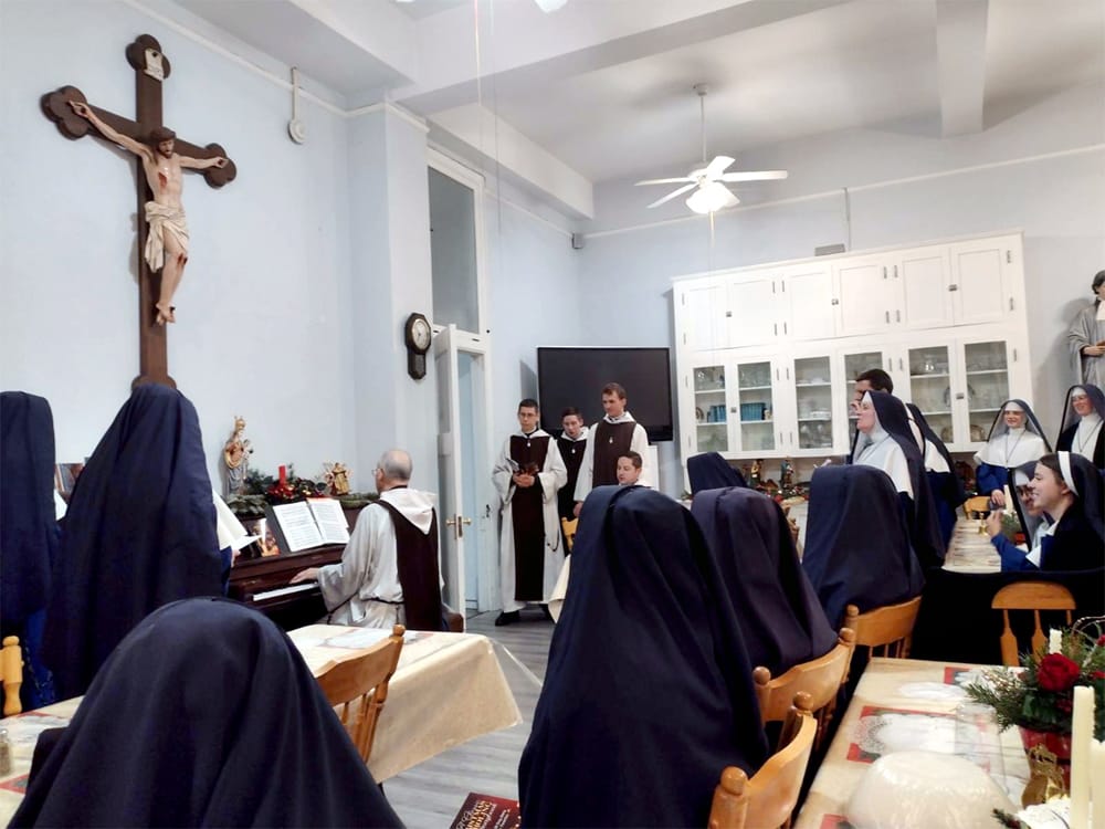 Christmas caroling with Fr. Casimir at the piano is a tradition at the convent. This year we were joined by our brethren from the major seminary in Idaho.