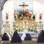 In addition to their private Holy Hours during the Forty Hours’ Devotion at Mount St. Michael, the Sisters made a common Holy Hour every afternoon. Sisters praying before Our Lord exposed on the altar during the Forty Hours at Mount St. Michael.