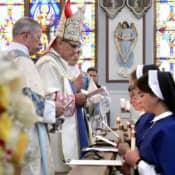 Bishop Pivarunas received the new postulants on the feast of the Divine Maternity.