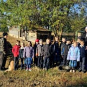 Sr. Mary Genevieve and the 1st, 2nd and 3rd graders visit the cow and the new calf on the seminary farm. Brother Simon and Felix, the seminary dog, came along.