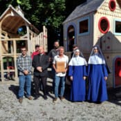 Fr. Letourneau, Sr. Mary Teresita and Sr. Maria Goretti with the owner of Cedar Works, who donated the new playground set for St. Theresa’s Church in Oakland, Maine.
