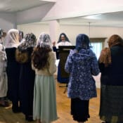 Sr. Mary Teresita directs the choir during Holy Week at St. Theresa’s Church in Maine.