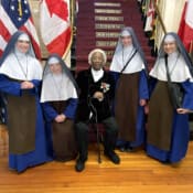 While touring Faneuil Hall in Boston, the Sisters from our New England missions visit with a 101-year-old veteran.