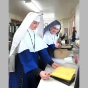 Sr. Helen Marie supervises a new order-filler at Mary Immaculate Queen Center in Spokane. Sr. Helen Marie supervises a new order-filler at Mary Immaculate Queen Center in Spokane.