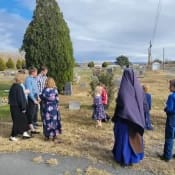 Sr. Mary Evangeline and students from Holy Guardian Angels School visit a local cemetery. Sr. Mary Evangeline and students from Holy Guardian Angels School visit a local cemetery.
