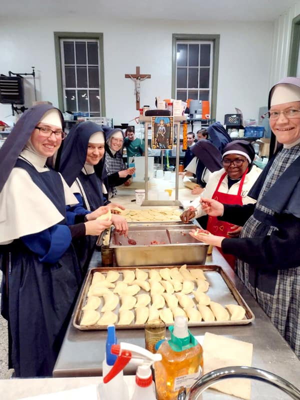 “How many hundreds of these Lithuanian dumplings did you say we needed to make for Fr. Casimir’s surprise feastday celebration?”
