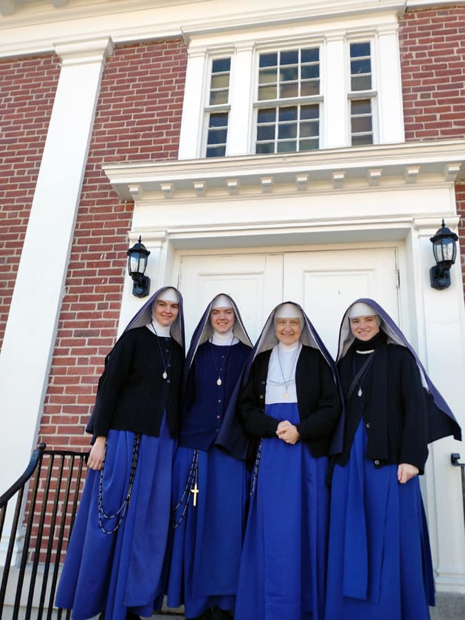 Our four New England missionaries in front of Our Lady of Mount Carmel Church in Salem, New Hampshire.
