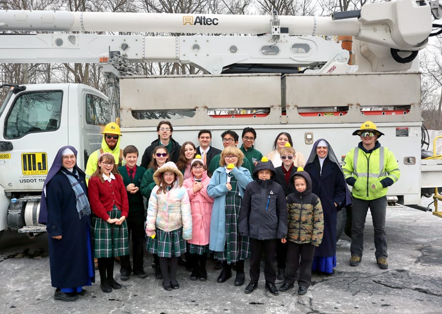 St. Joseph’s Academy students and Sisters (Wayne, Michigan) pose with electrical crew.