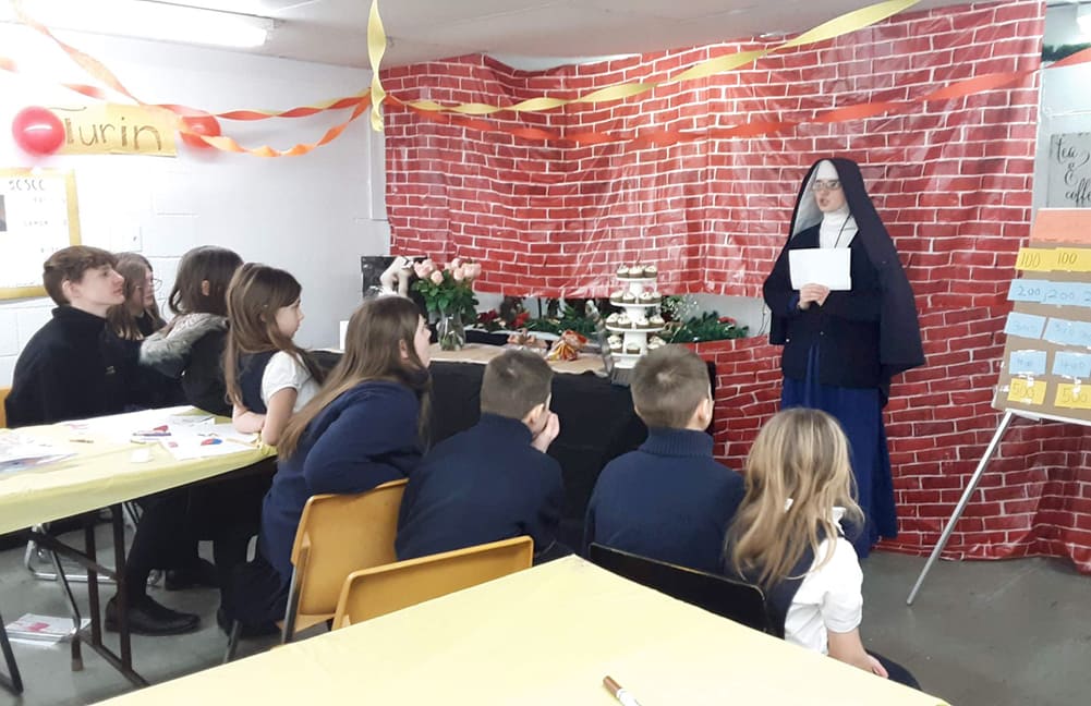Sr. Mary Teresita leads her students in a game on St. John Bosco Day during Catholic Schools Week.